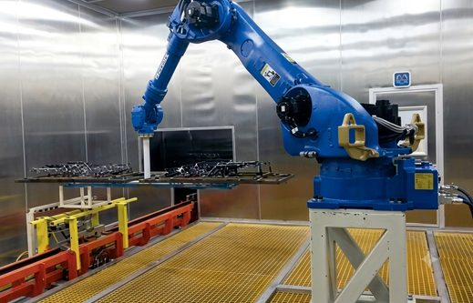 SAAJ painting robot applying coating on a conveyorised paint line